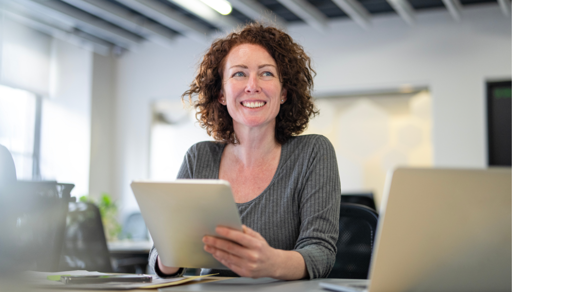 a business woman holding a tablet