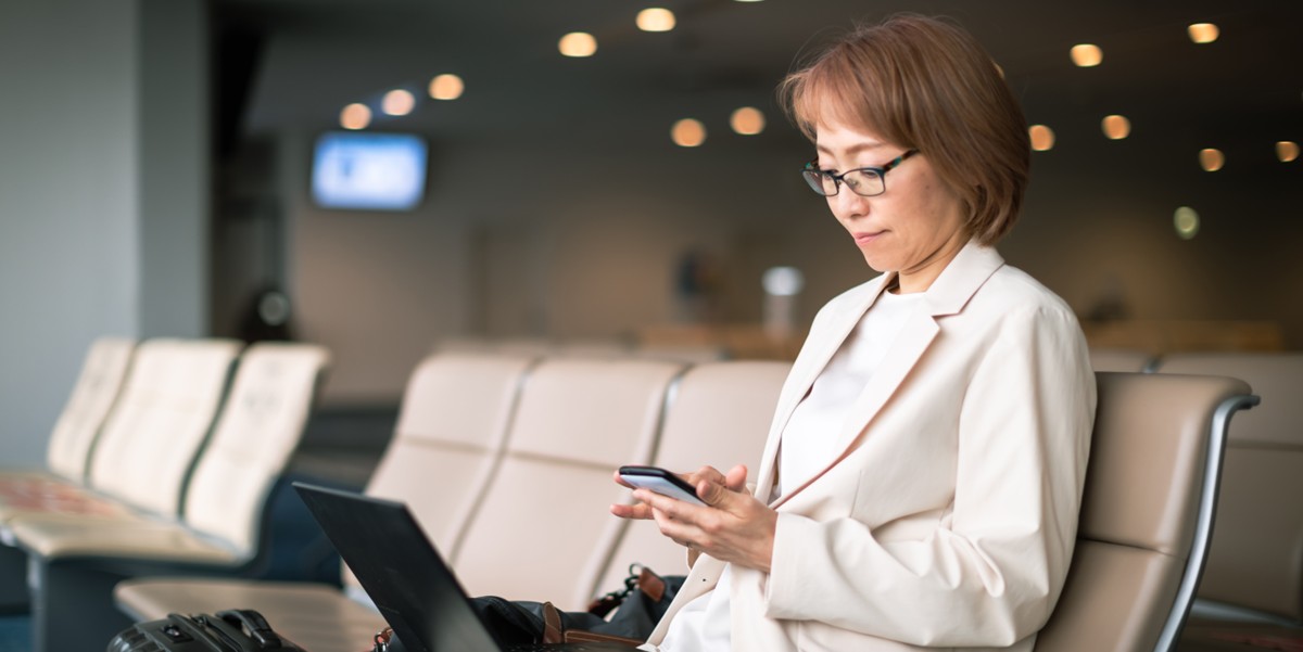 a woman at the airport boarding area