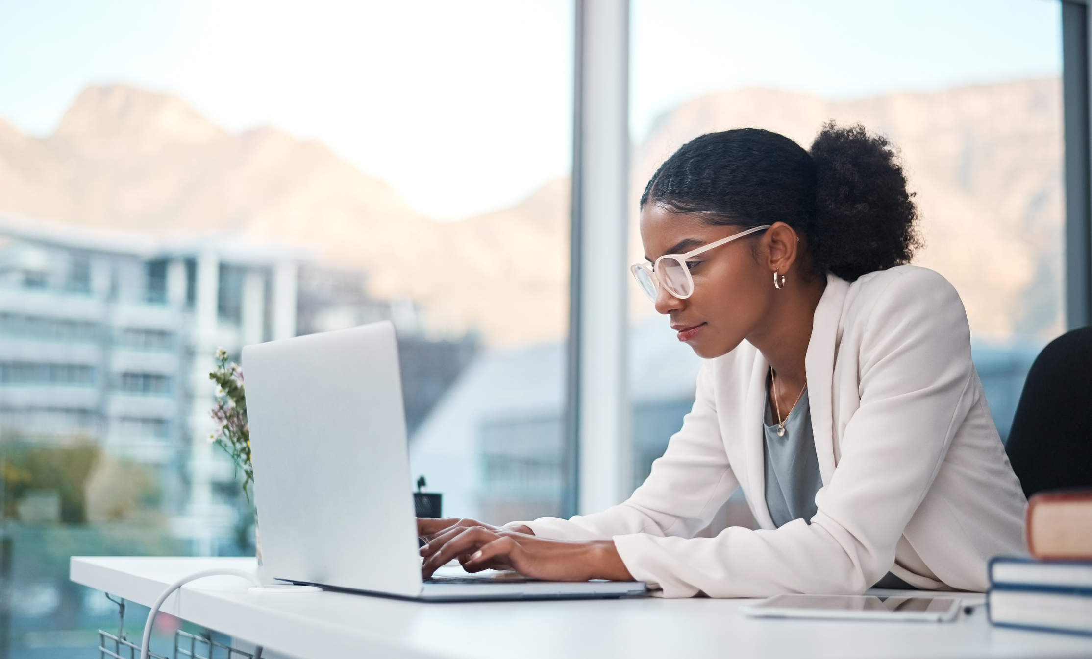 Woman working on her laptop in the office. 
