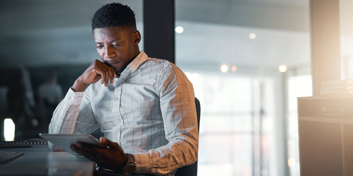 Man looking at tablet