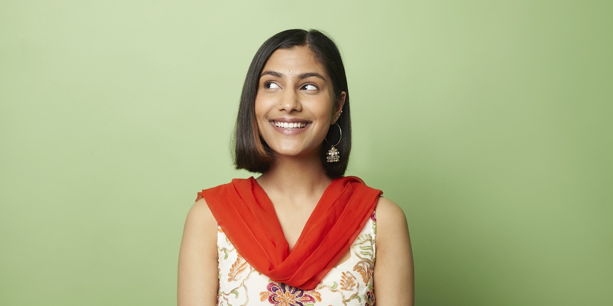 Woman smiling and looking to the side 