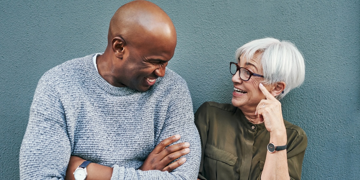 Woman and man looking at each other and smiling 