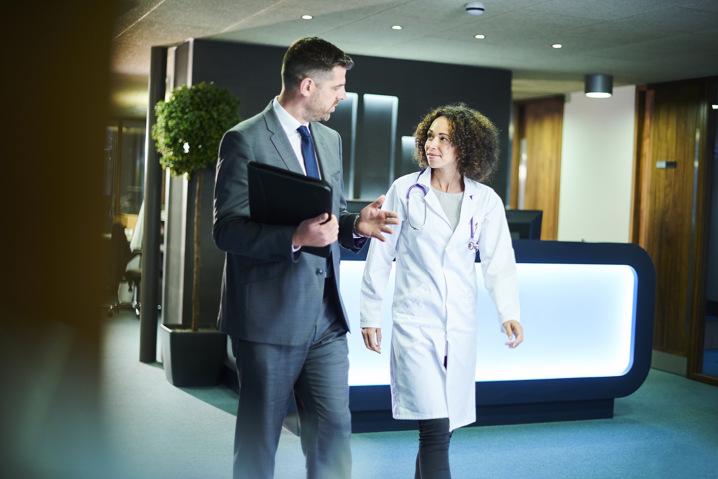woman doctor and man in suit