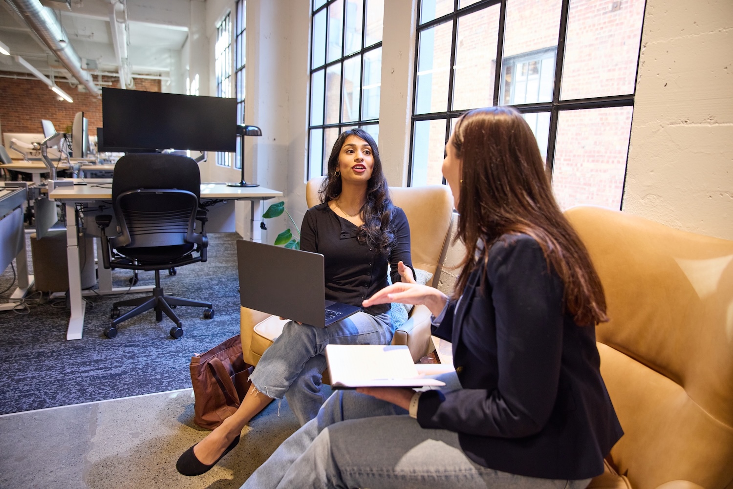women talking computers