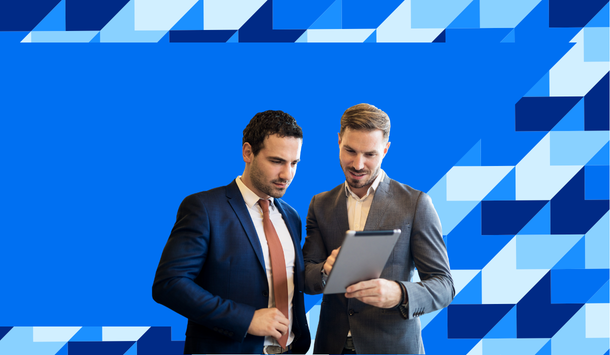 two men looking at tablet