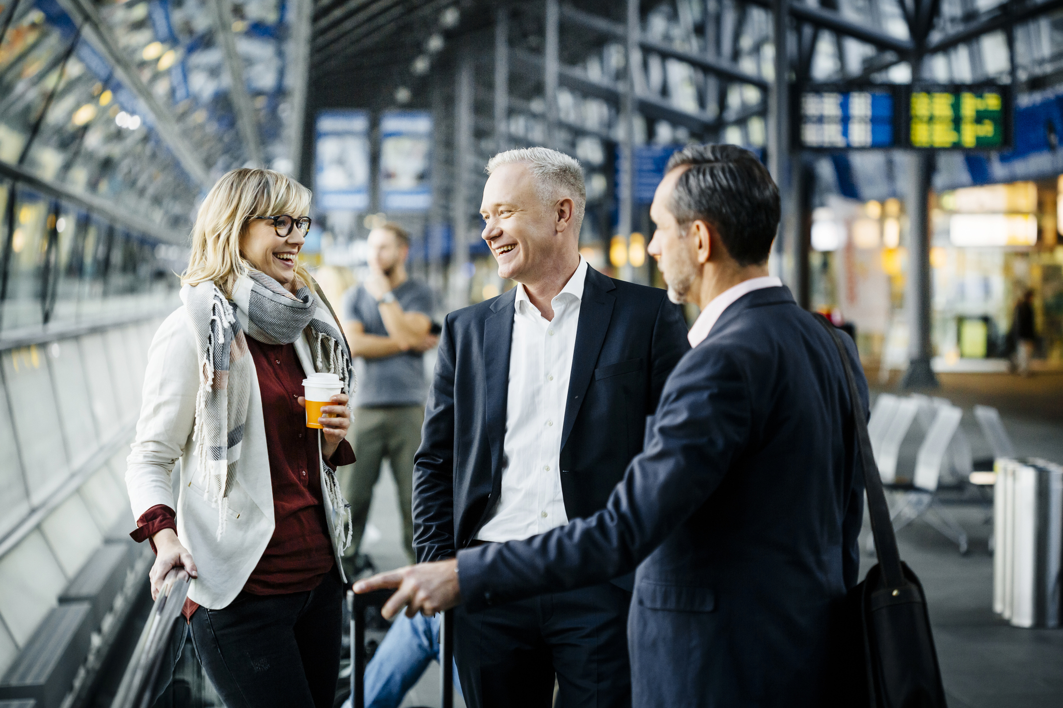 Group of mature business people meeting at the airport