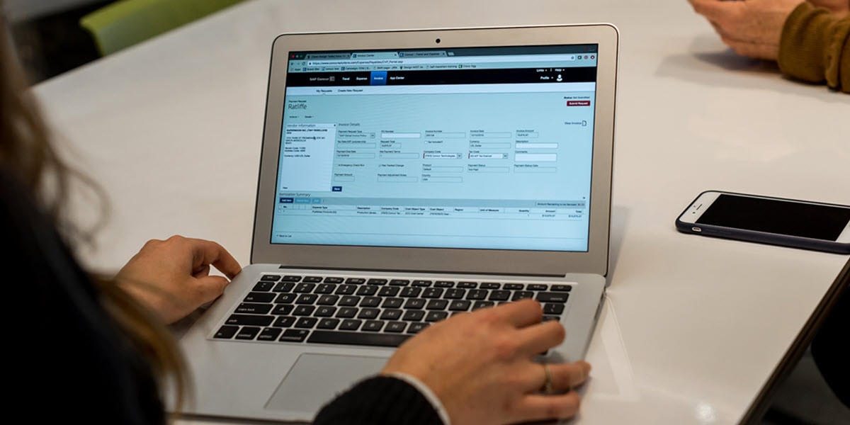 Concur Invoice on laptop screen