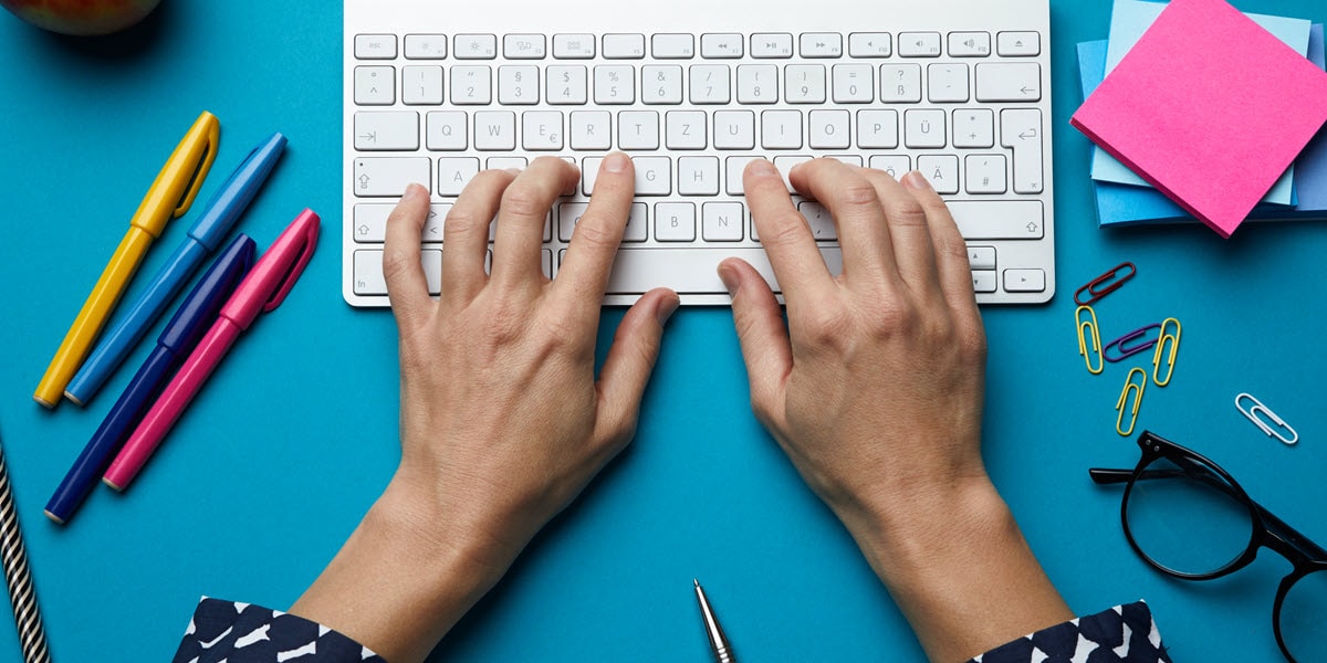 Hands typing on keyboard