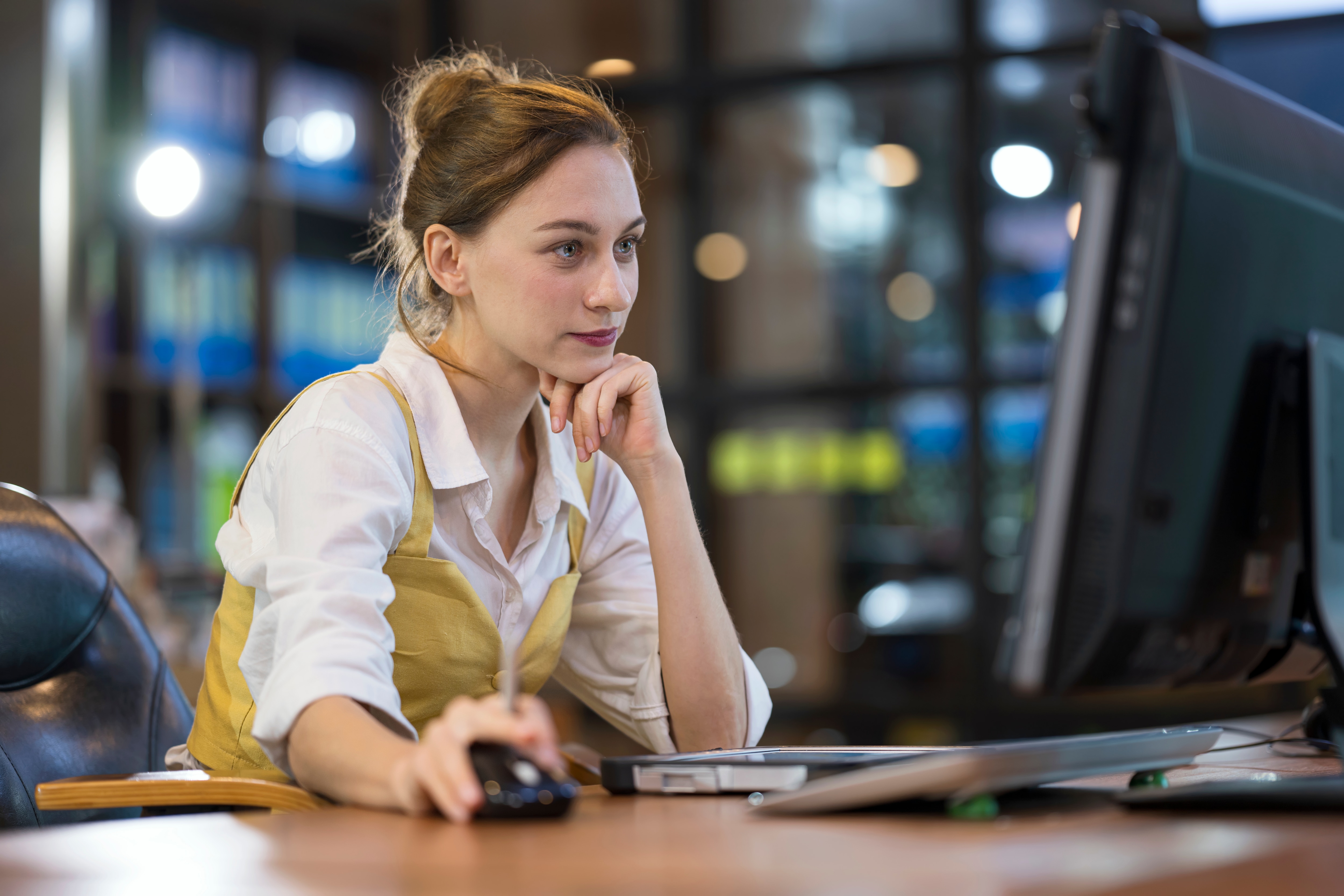 a woman looking at the screen