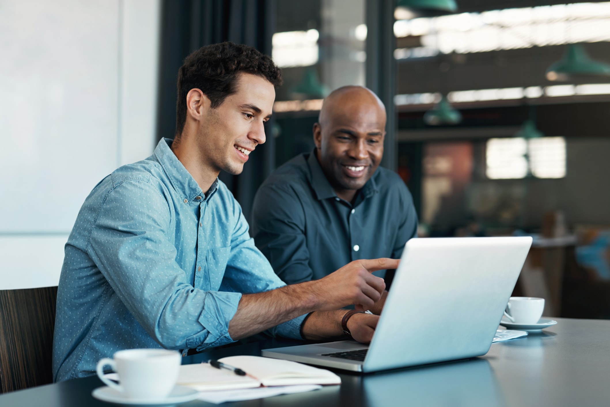 men looking at computer