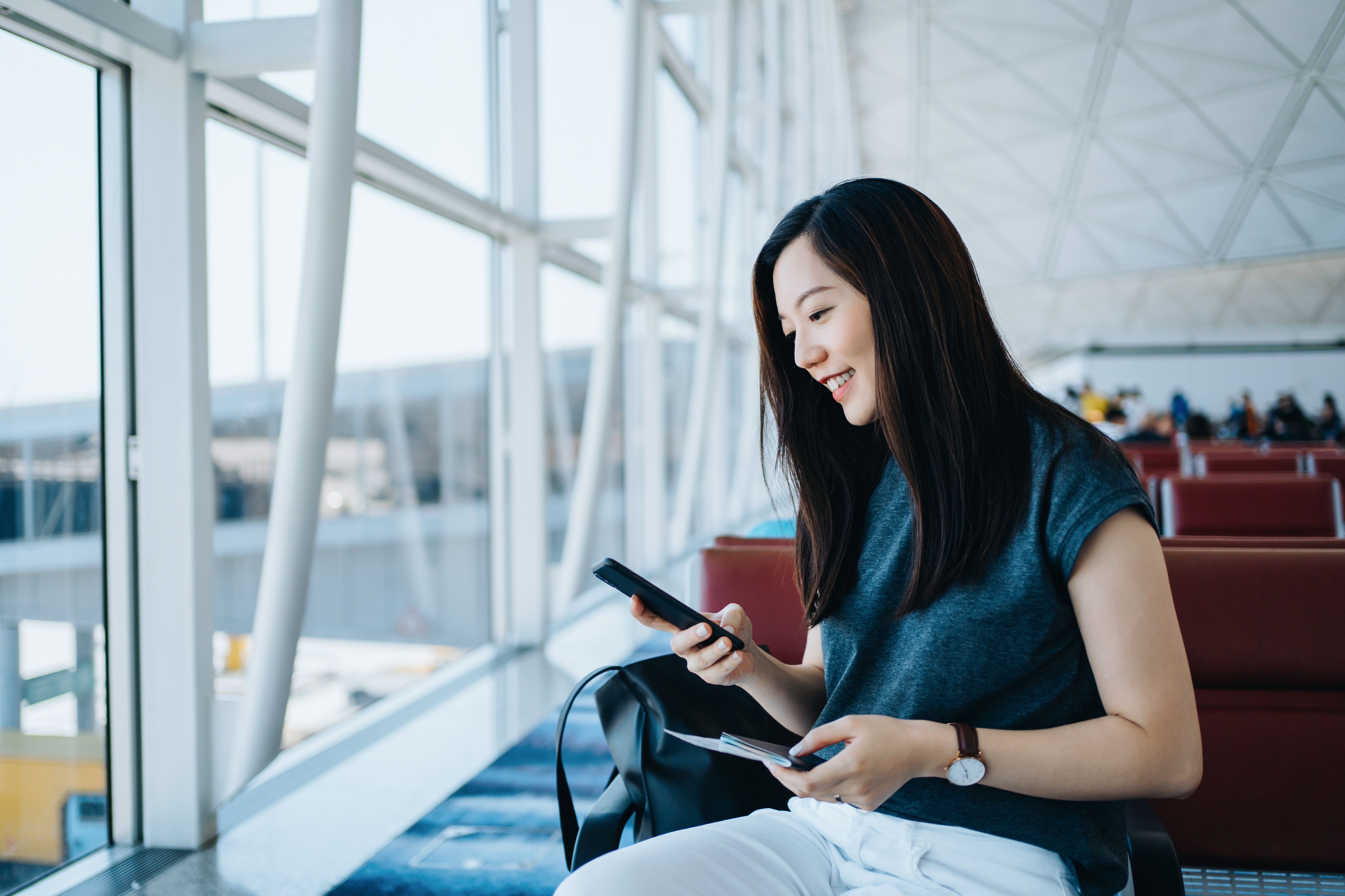 Woman in an airport on her phone
