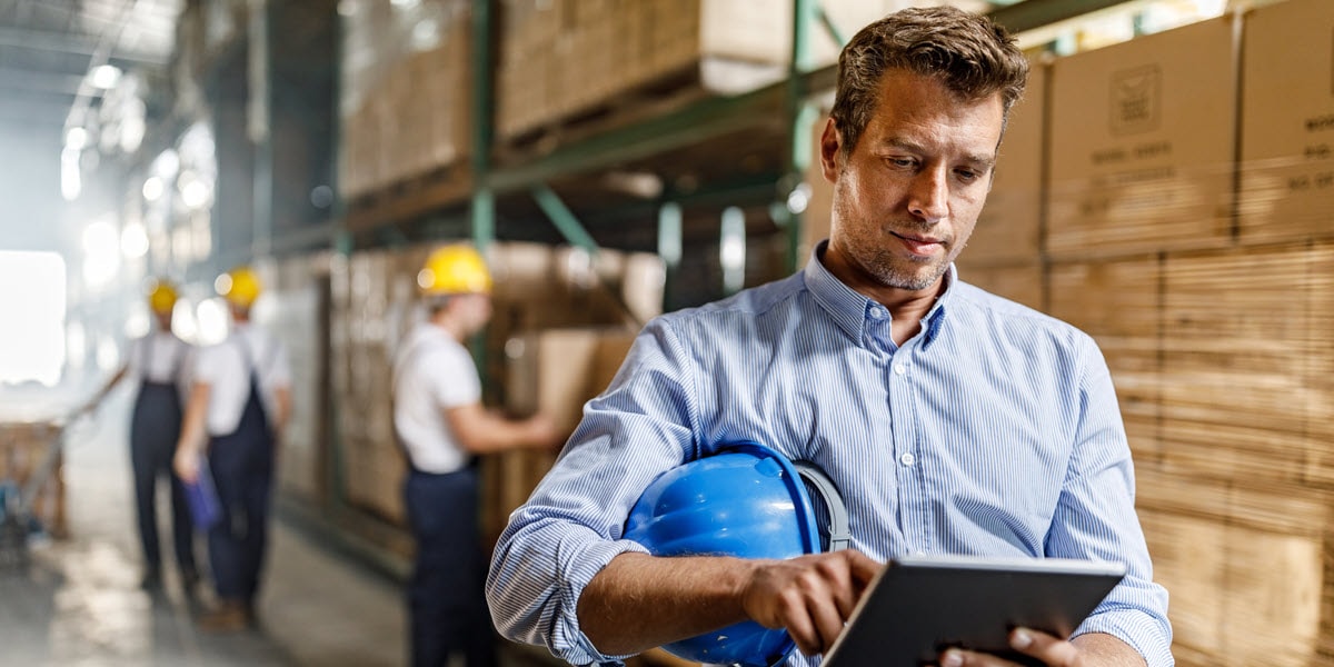 Man looking at tablet in warehouse 