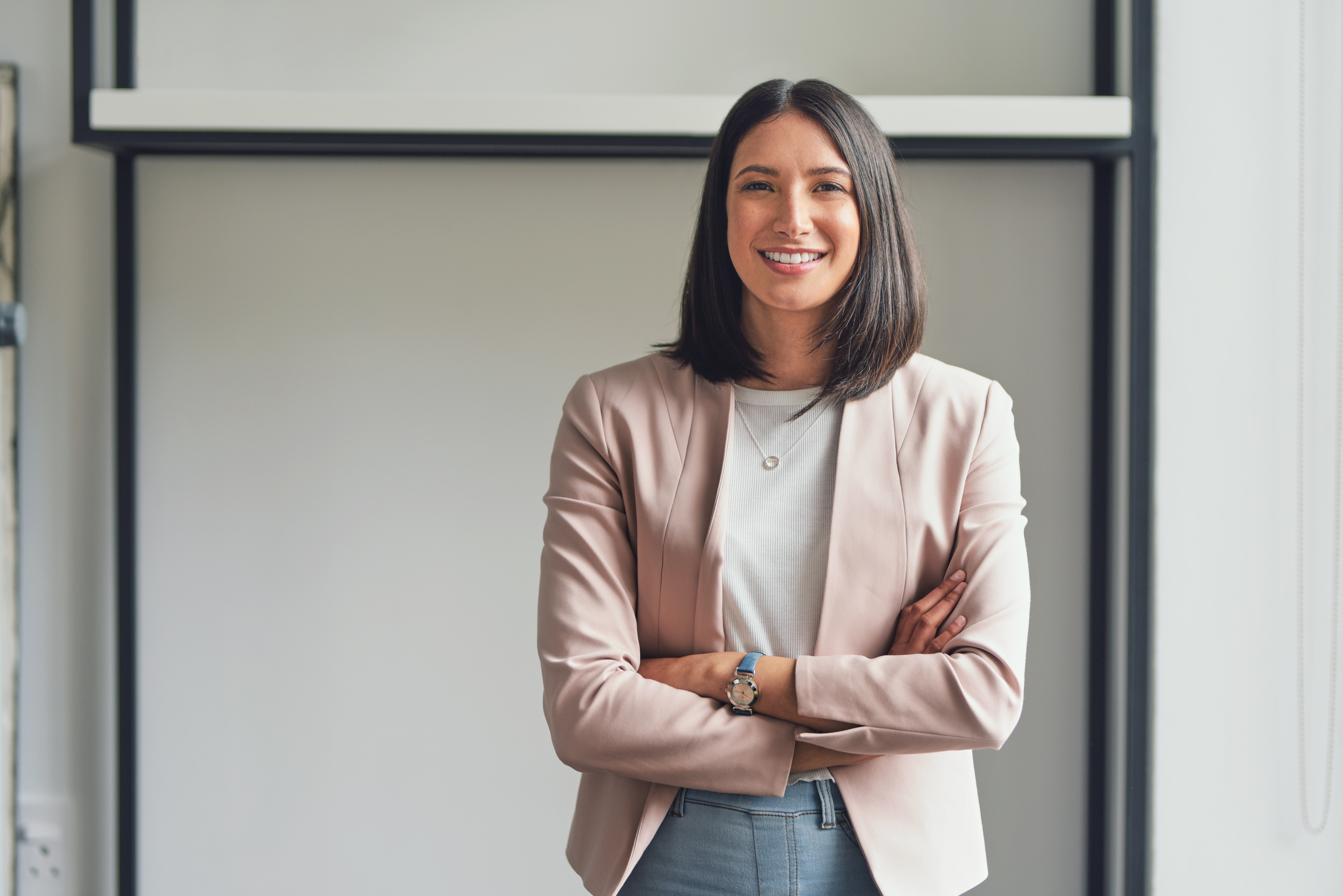 A business woman in a pink blazzer