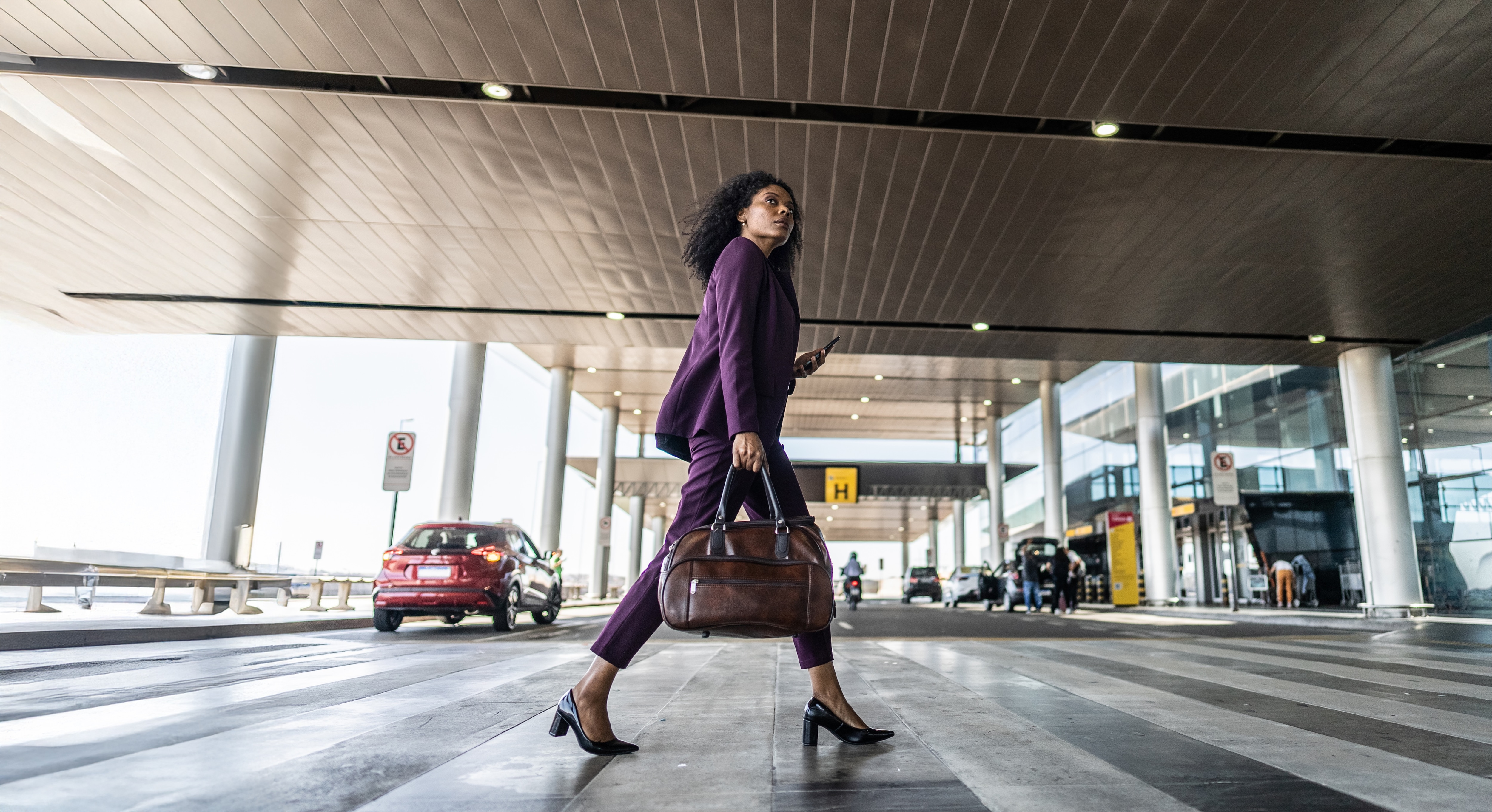 woman, business traveler, airport, travel, mobile, African decent