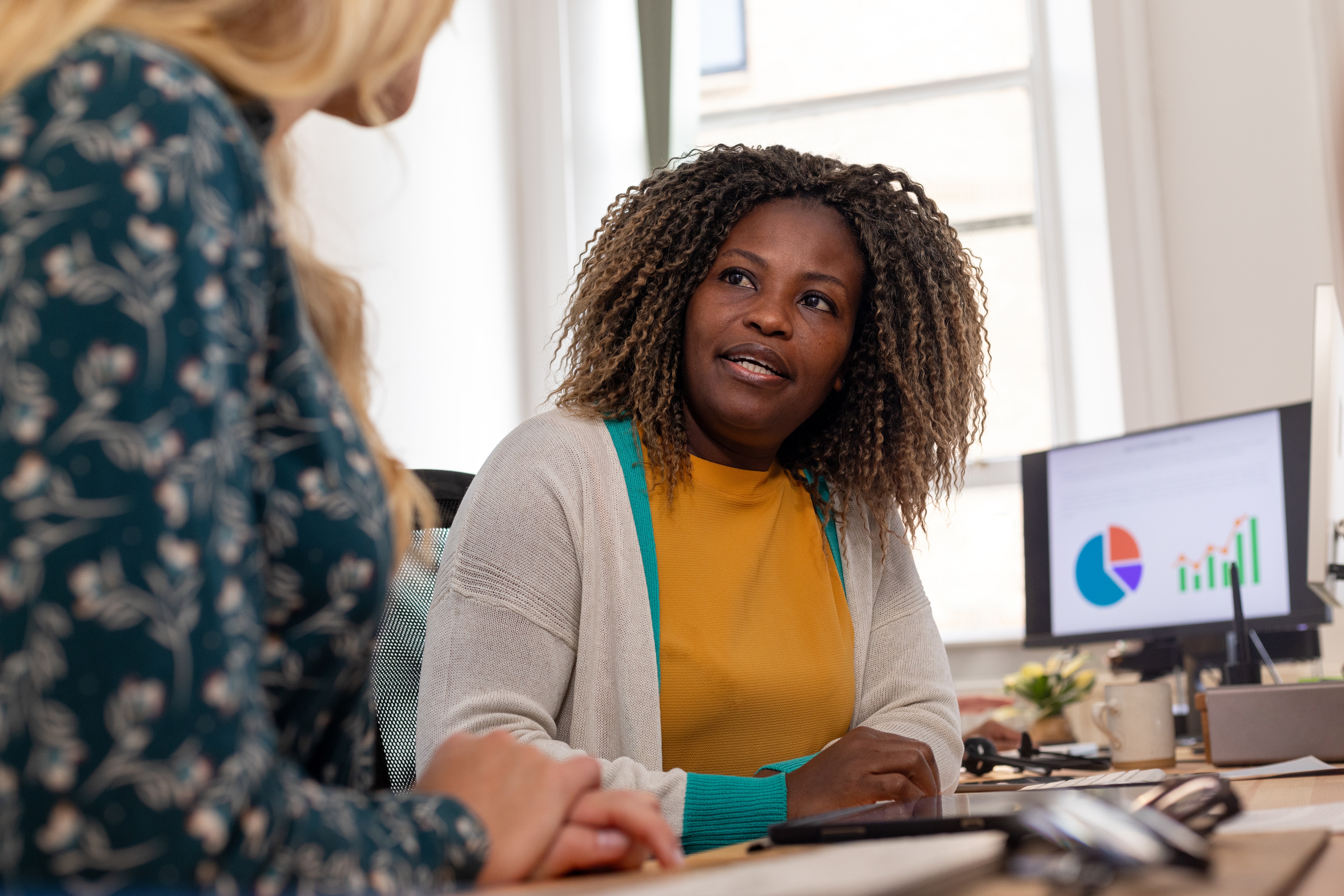 Two accounts payable professionals having a discussion