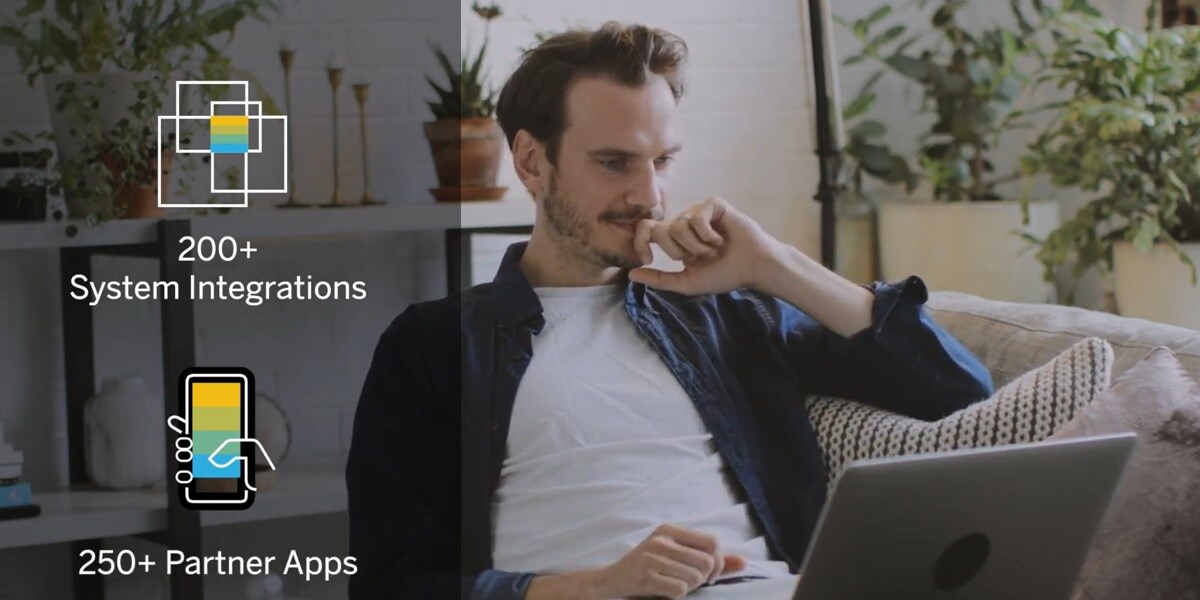 Screen shot from the video of a person sitting on a couch working from home