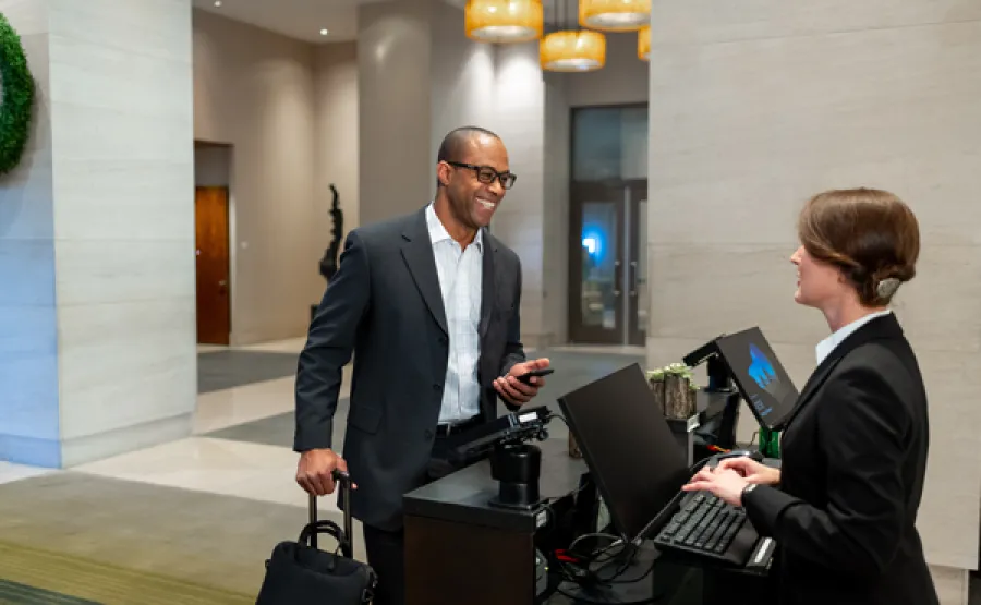 Man checking in at hotel