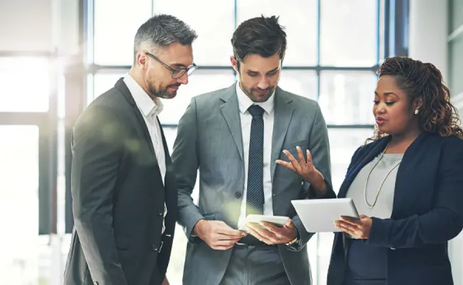 three people in a meeting