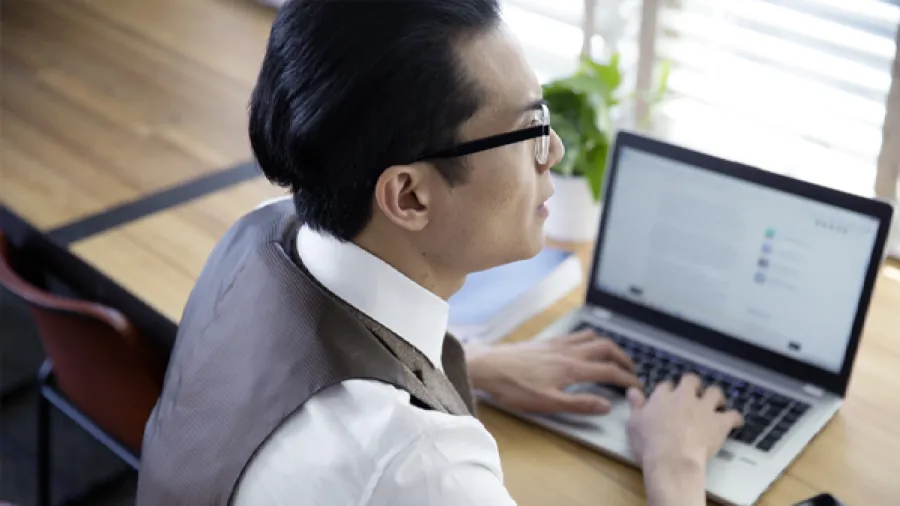 IT leader managing their work on laptop