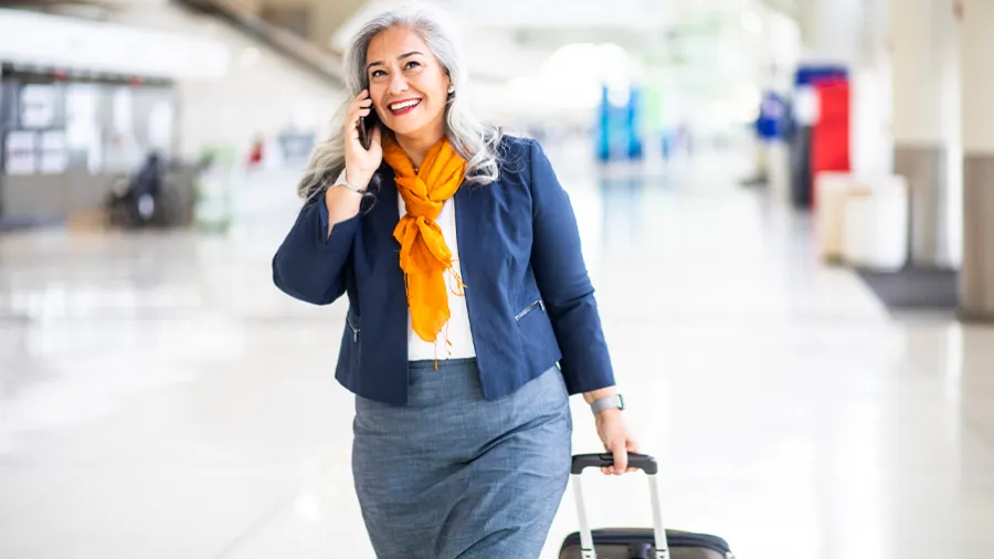 woman on the phone at the airport