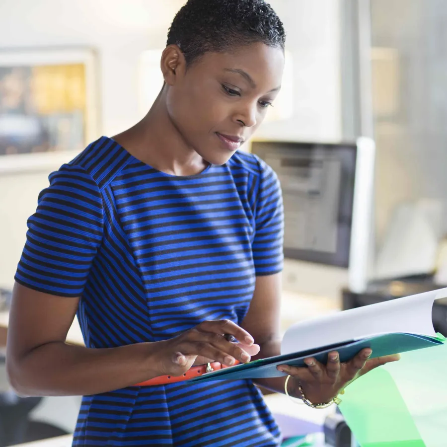 Person looking at paper in folder