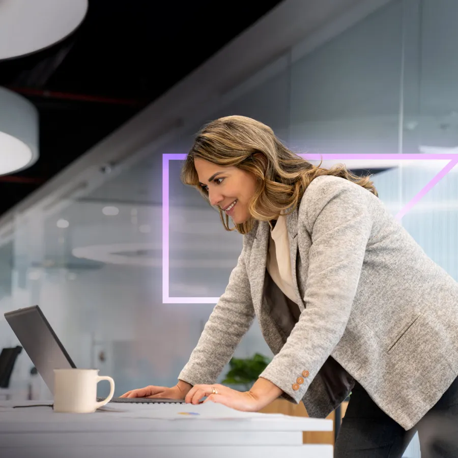 Woman in office looking at computer