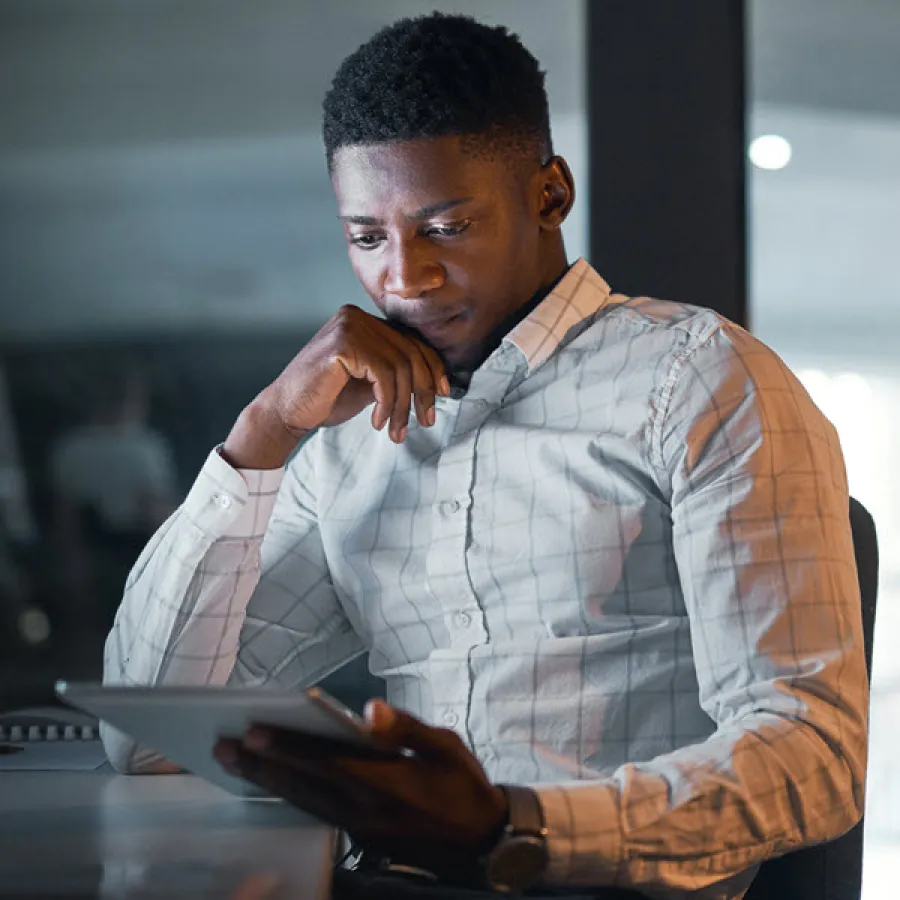 Man looking at tablet