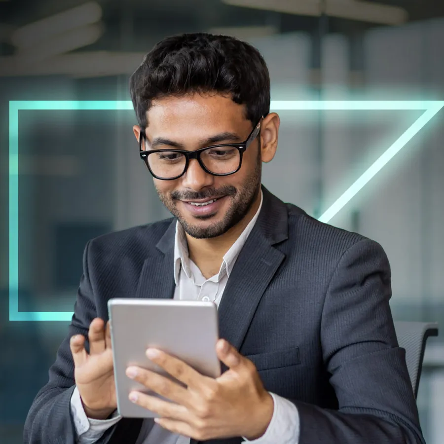 smiling man looking at tablet