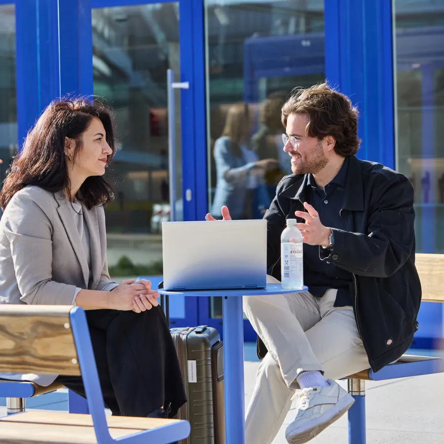 two people chatting outside