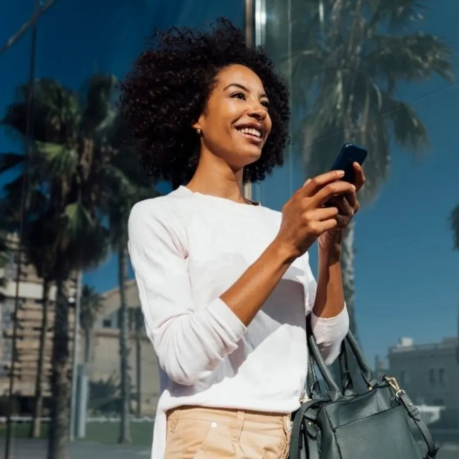 woman walking outside with phone