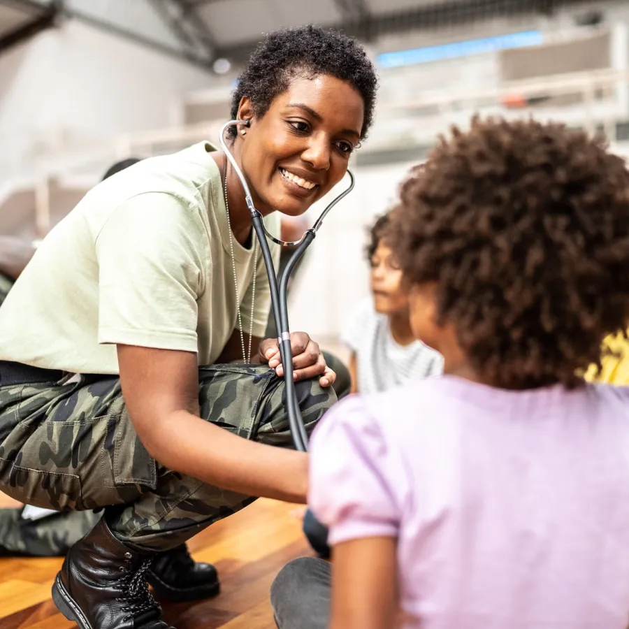 Woman helping a child